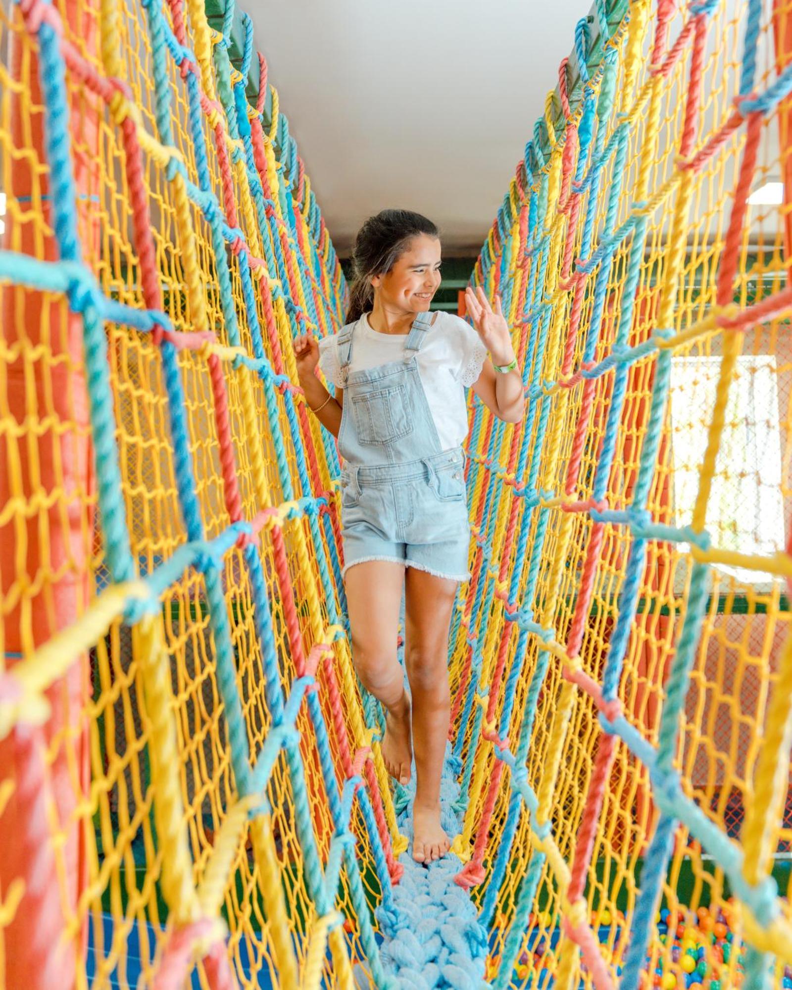 Hard Rock Hotel & Casino Punta Cana (Adults Only) Extérieur photo A girl walking on a rope bridge